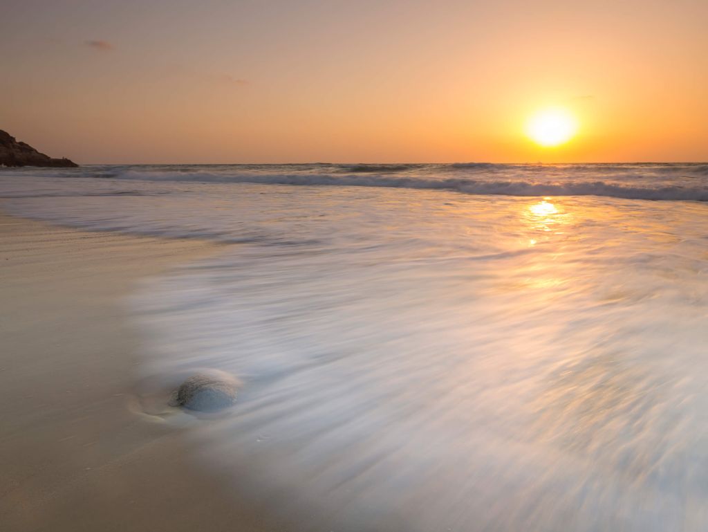 Zonsondergang bij het strand